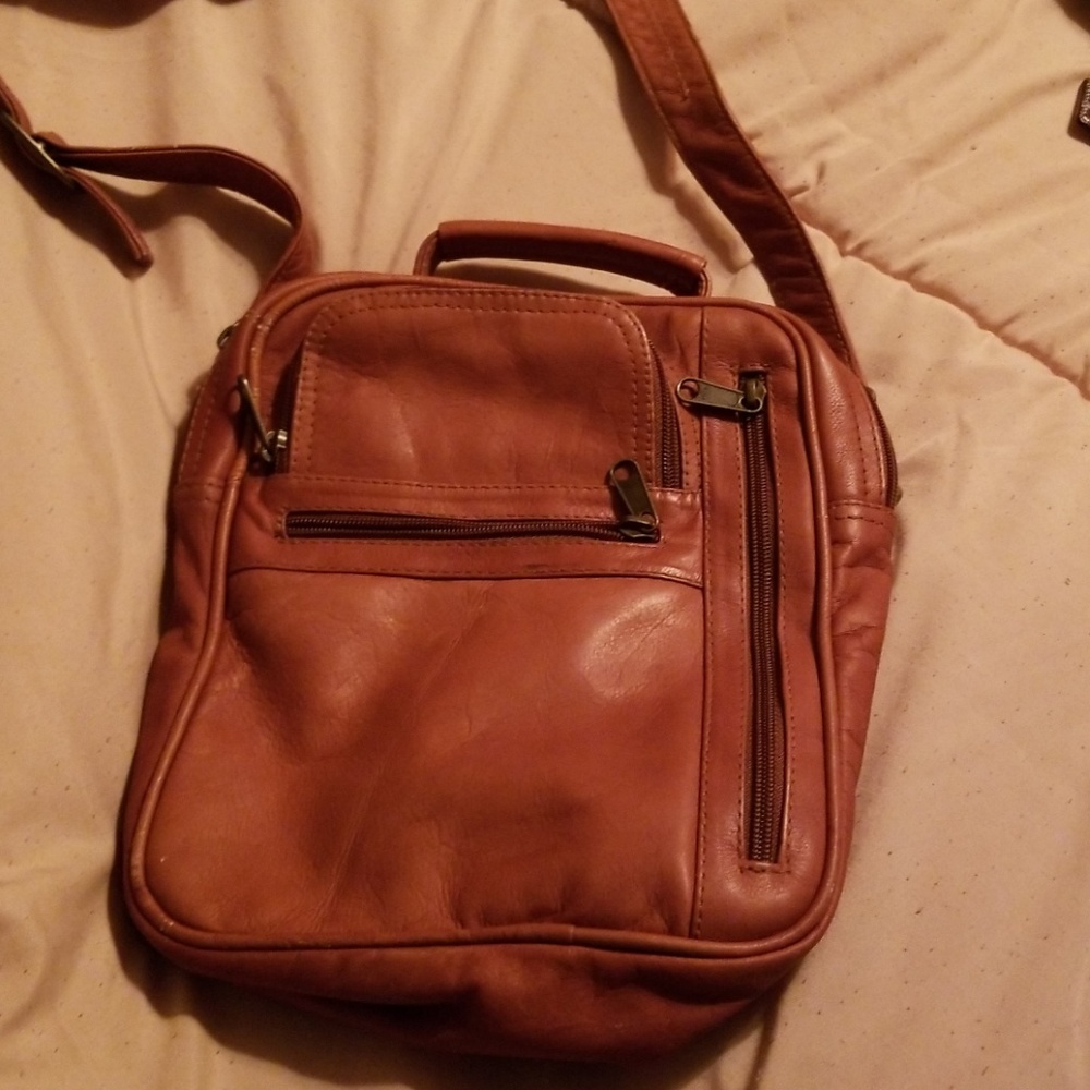 All leather small messenger bag from Italy.
